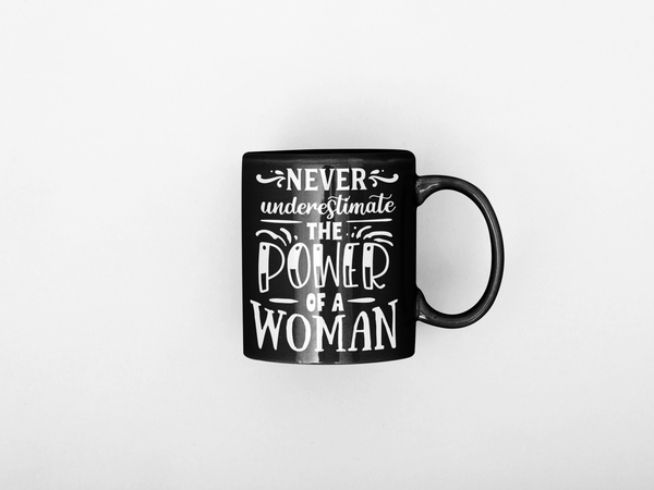 Never Underestimate The Power Of A Women Black Mug