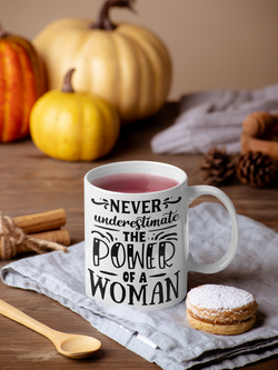 Never Underestimate The Power  Of A Women White Mug